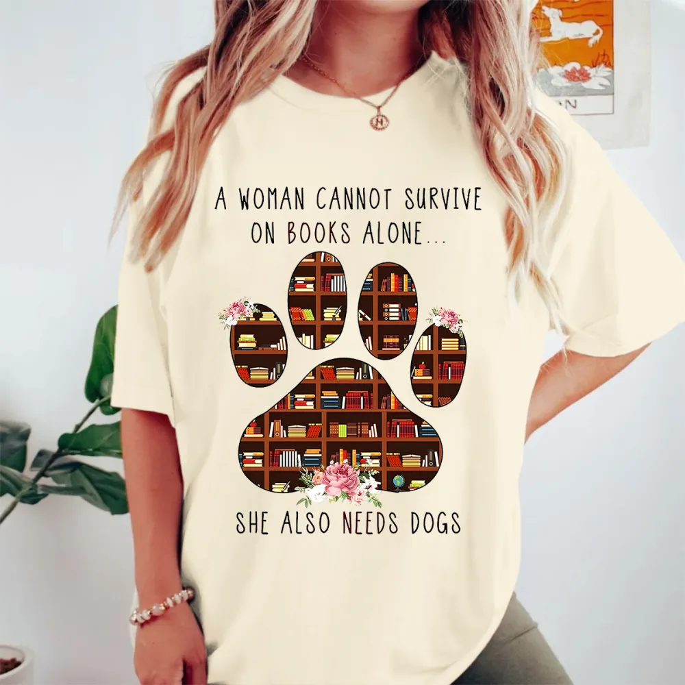 A Woman Cannot Survive On Books Alone She Also Needs Dogs Graphic Tee
