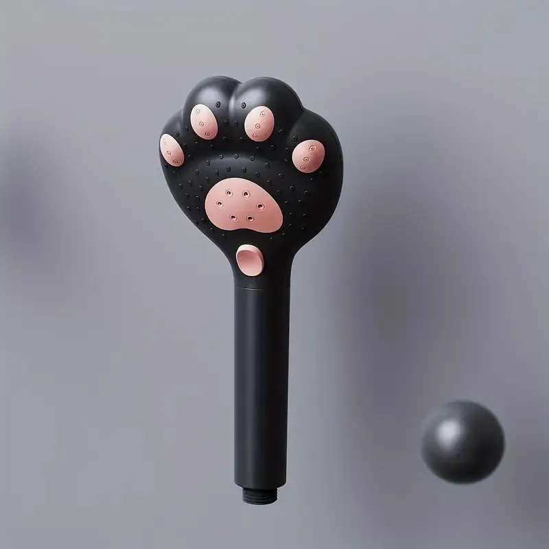 A Handheld Shower Head With A Cat Paw Design Appearance