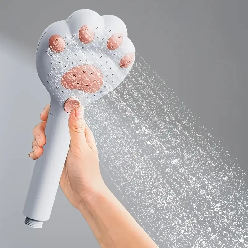 A Handheld Shower Head With A Cat Paw Design Appearance